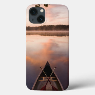 A canoe rests on the shore of Pawtuckaway Lake iPhone 13 Case