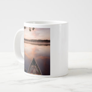 A canoe rests on the shore of Pawtuckaway Lake Large Coffee Mug