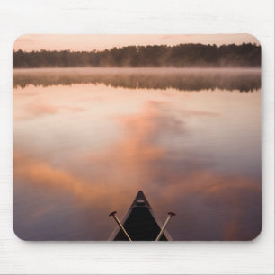 A canoe rests on the shore of Pawtuckaway Lake Mouse Pad