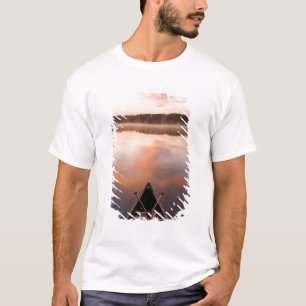 A canoe rests on the shore of Pawtuckaway Lake T-Shirt