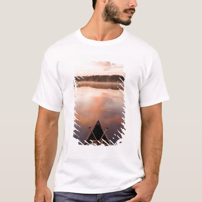 A canoe rests on the shore of Pawtuckaway Lake T-Shirt (Front)
