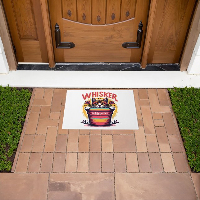 A cat peeking out from behind a flowerpot doormat (Outdoor)