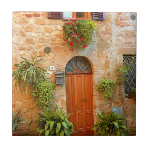 A cat seeks entrance to home in Pienza, Italy Ceramic Tile