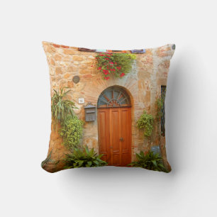 A cat seeks entrance to home in Pienza, Italy Cushion