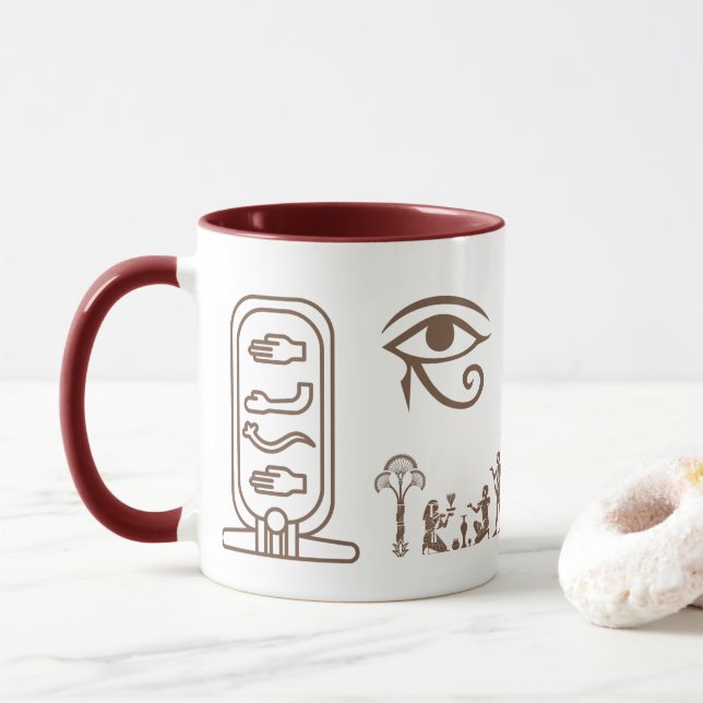 A ceramic mug with an ancient Egyptian design  (With Donut)