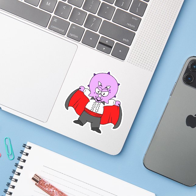 A Ceratops Dinosaur Dressed Up As Count Dracula. (Laptop w/ iPhone)