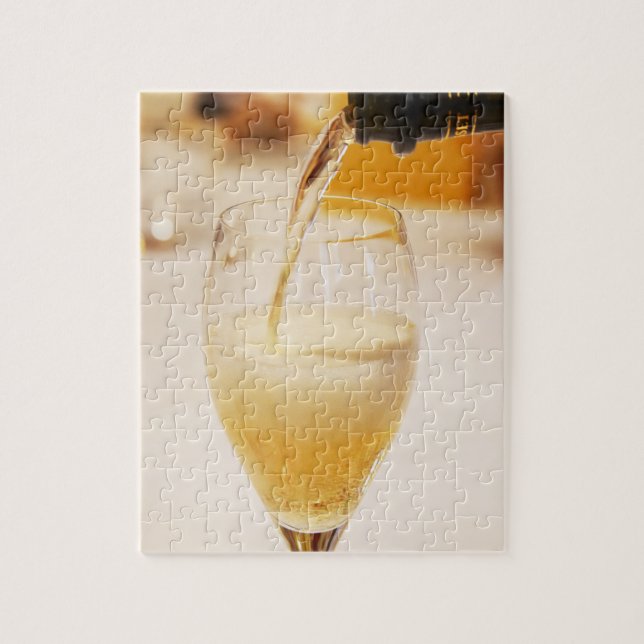 A champagne glass flute being filled with Gosset Jigsaw Puzzle (Vertical)