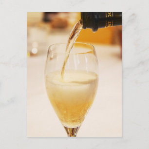 A champagne glass flute being filled with Gosset Postcard