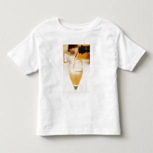A champagne glass flute being filled with Gosset Toddler T-Shirt
