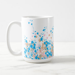 A charming arrangement of blue and pink flowers se coffee mug