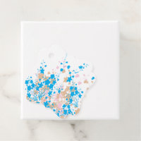 A charming arrangement of blue and pink flowers se