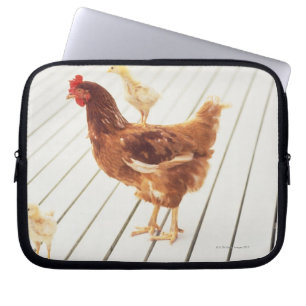 A Chicken and Two Chicks On a Wooden Floor, Laptop Sleeve