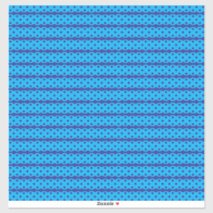 A clear blue sky stretches above a calm, deep blue