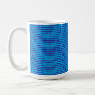 A clear blue sky stretches above a calm, deep blue coffee mug