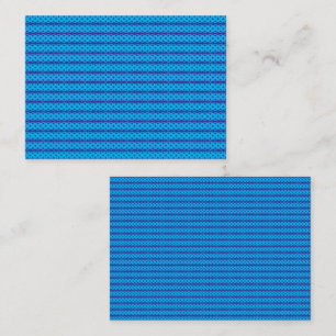 A clear blue sky stretches above a calm, deep blue place card