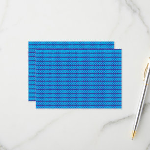 A clear blue sky stretches above a calm, deep blue RSVP card
