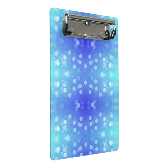 A clipboard featuring a blue and teal bokeh patter (Angled)