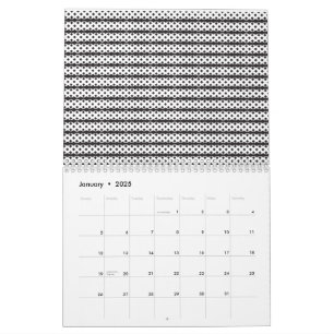 A close-up of a fluffy orange and white cat lying calendar