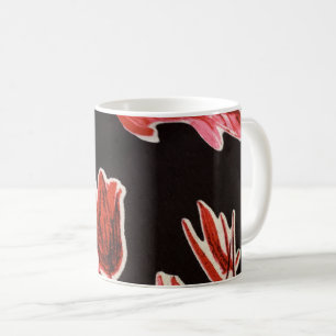 A close-up photograph of a fabric with a floral pa coffee mug