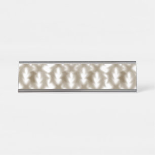 A close-up view of a crisscrossing wire mesh grid desk name plate
