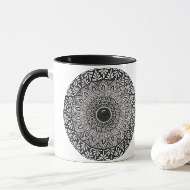A coffee mug with monochrome mandala design (With Donut)