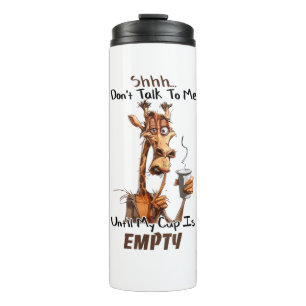 A Cold Giraffe With A Cup Of Coffee