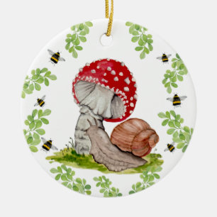 A colourful forest fly and a snail ceramic ornament