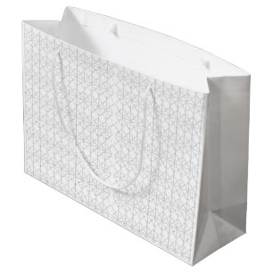 A colourful rug with an intricate geometric patter large gift bag