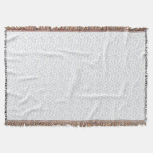 A completely white, featureless surface fills the throw blanket