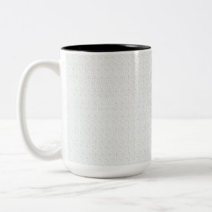 A completely white, featureless surface fills the  Two-Tone coffee mug