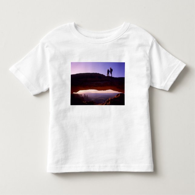 A couple watches sunrise from atop Mesa Arch in Toddler T-Shirt (Front)
