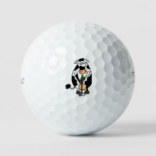 A cow playing golf balls