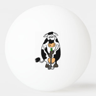 A cow playing golf ping pong ball