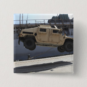 A crane lifts an M998 Humvee 15 Cm Square Badge