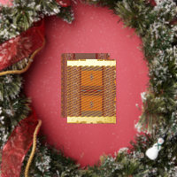 a cross stitch pattern in orange and brown