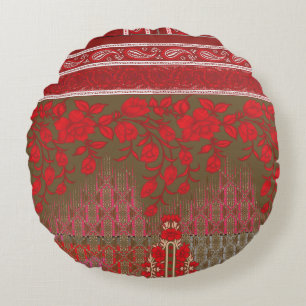 a cross stitch pattern with red flowers and vines round cushion
