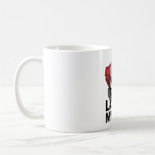 A crying clown face coffee mug
