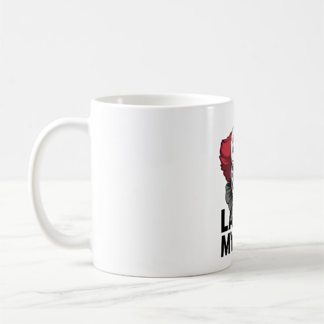 A crying clown face coffee mug (Left)