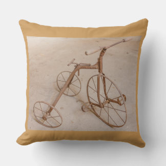 a cushion with a photo of an old tricycle