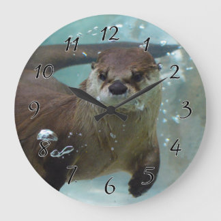 A cute Brown otter swimming in a clear blue pool Large Clock