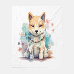 A cute well-behaved dog in a floral fleece blanket
