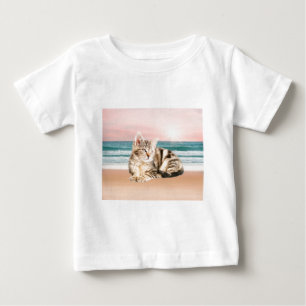 A Cuter Striped Cat Sitting on Beach with sunset Baby T-Shirt