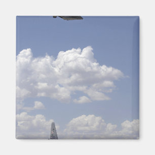 A CV-22 Osprey flies over a C-130 Hercules Magnet