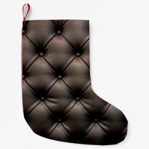 A dark leather cushion background, from a car seat small christmas stocking