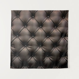 A dark leather cushion background, from a car seat tapestry