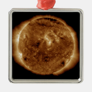 A dark rift in the sun's atmosphere metal tree decoration