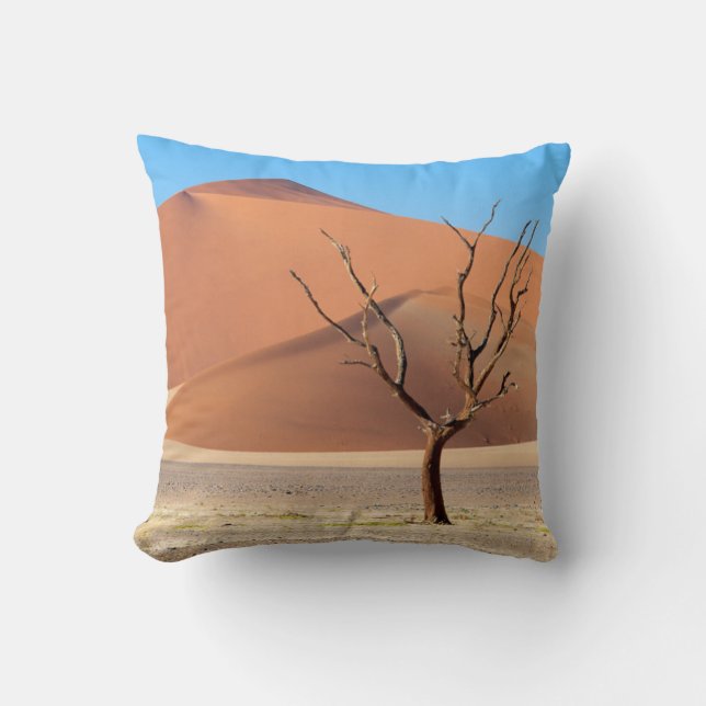 A dead tree on a desert plain with dunes cushion (Front)