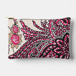 A decorative paisley design with vivid red and pin accessory pouch
