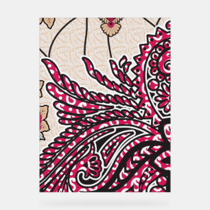 A decorative paisley design with vivid red and pin acrylic sign