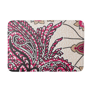 A decorative paisley design with vivid red and pin bath mat